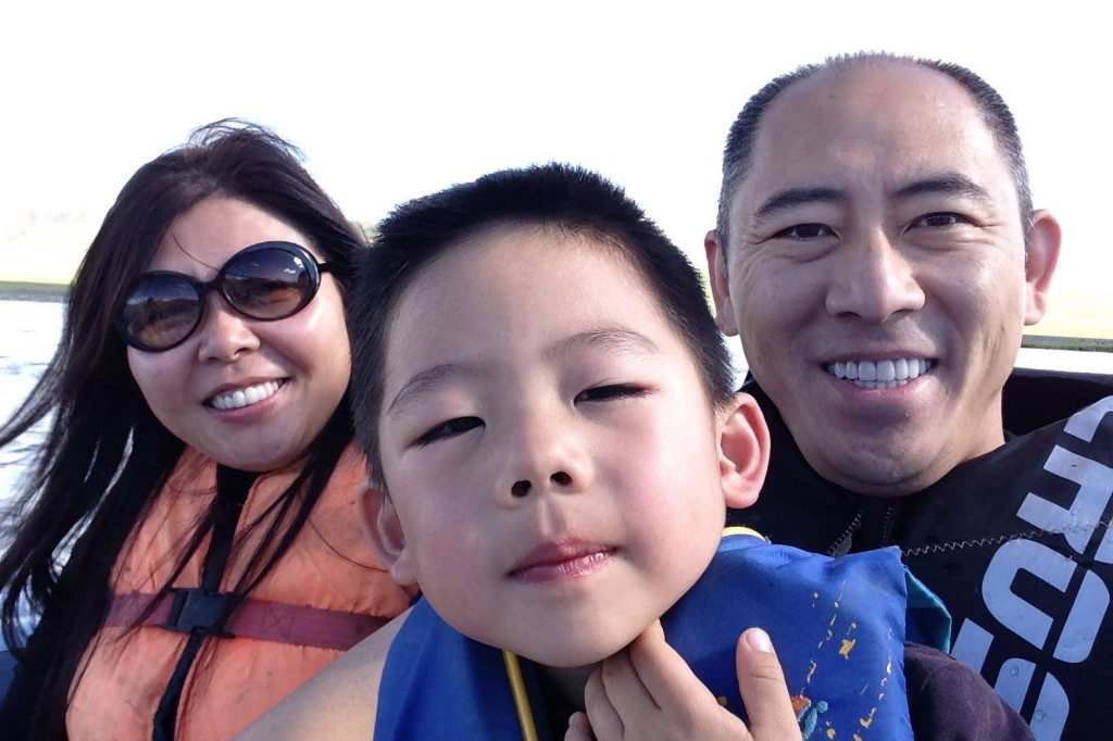 Whitney Duan and Desmond Shum with their son Ariston.